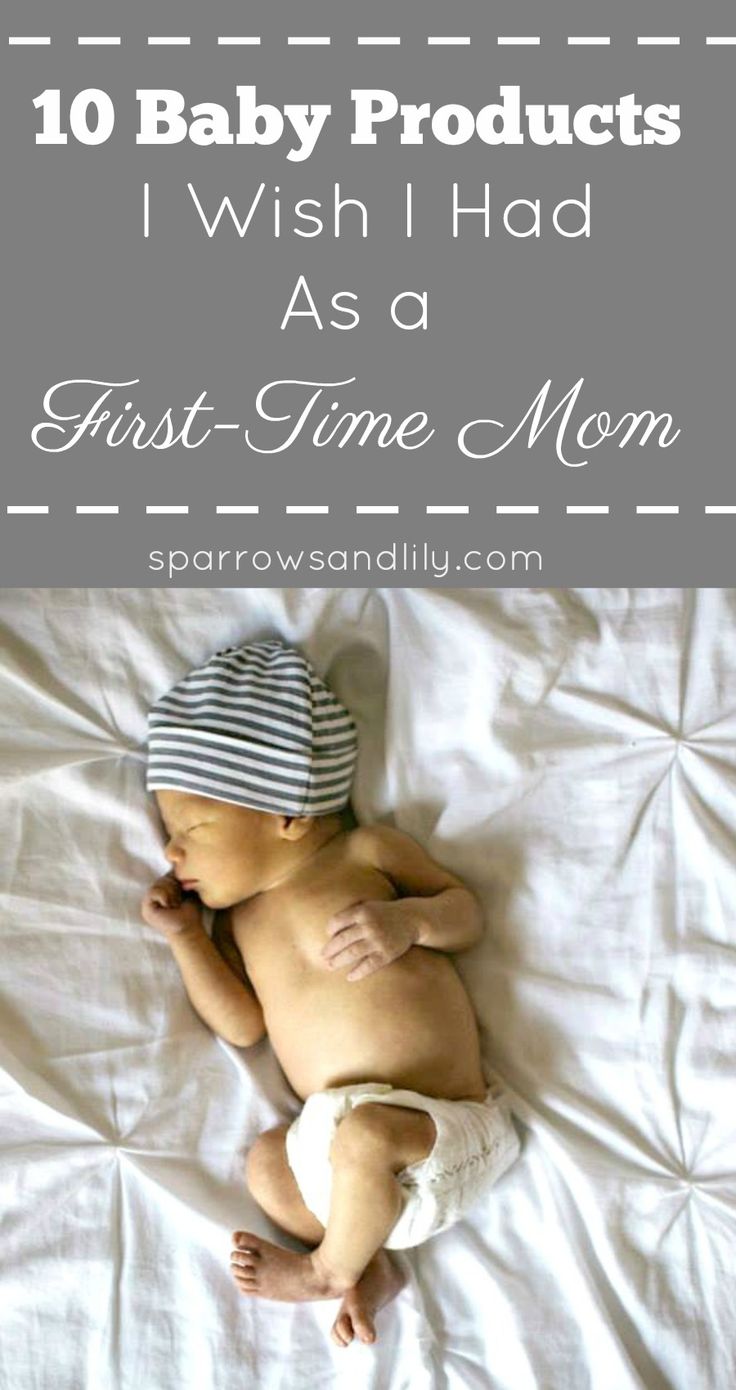 a baby laying on top of a bed with the words 10 baby products wish i had as