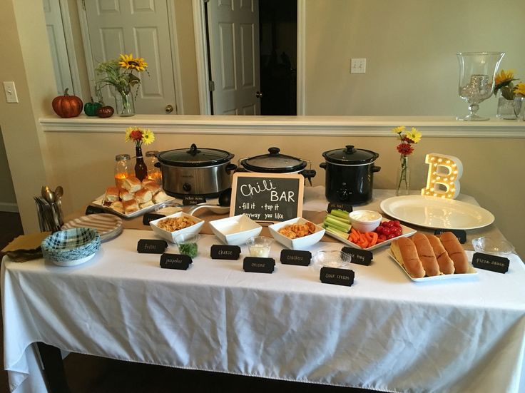 a table topped with lots of food next to a mirror