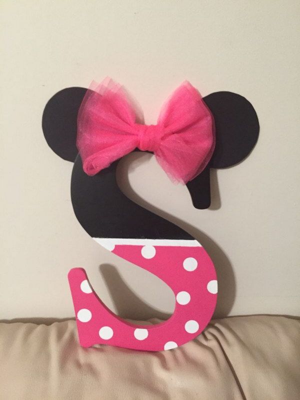 a minnie mouse head with a pink bow on it's head and the number 2