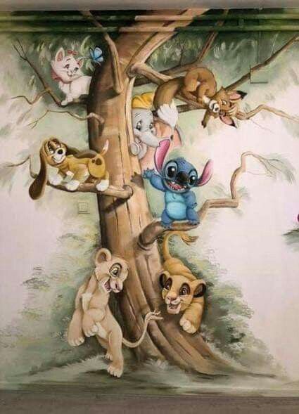 the mural on the wall depicts several different animals in a tree, including an elephant and lion cub