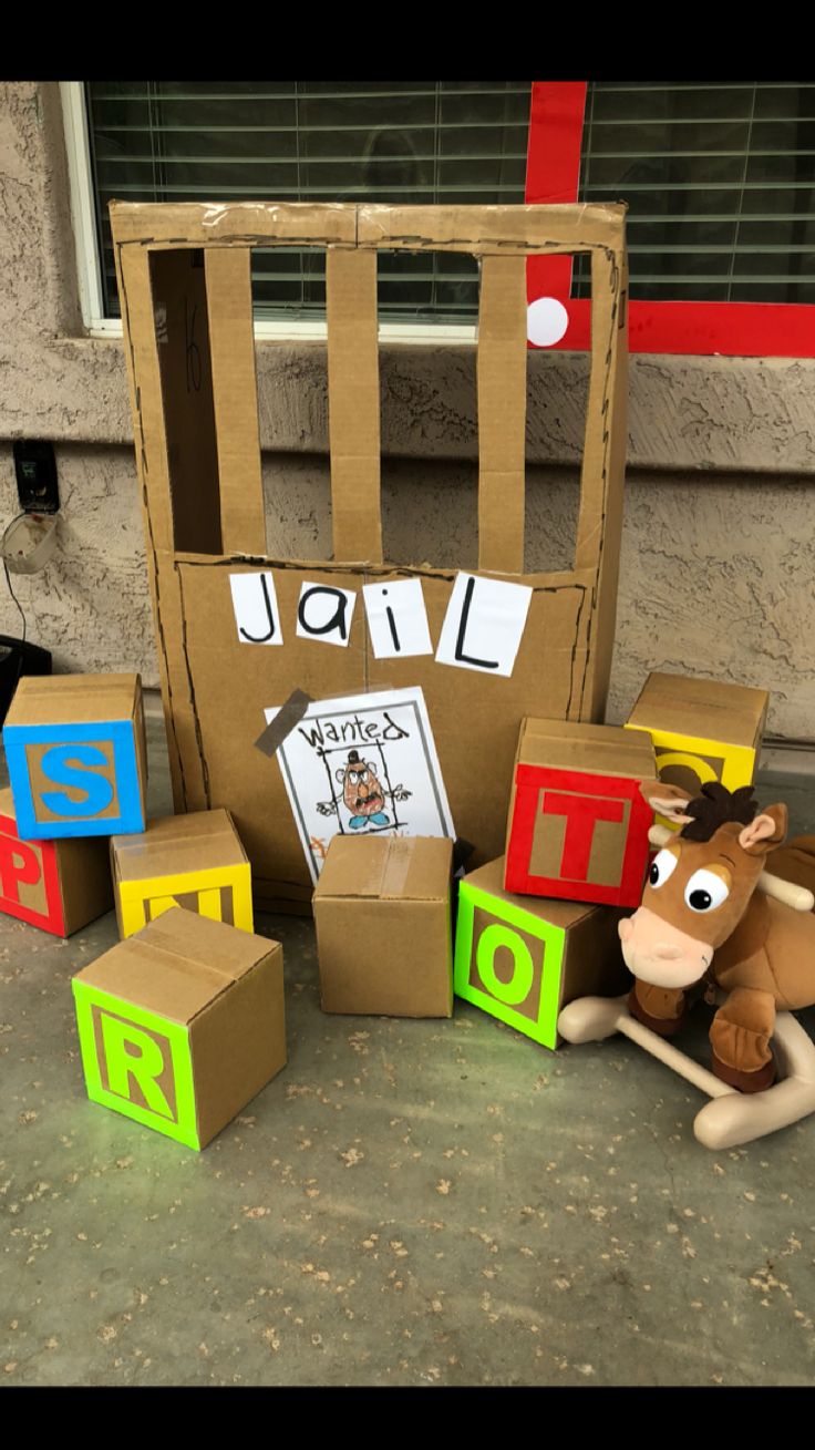 cardboard boxes and toys are sitting on the ground