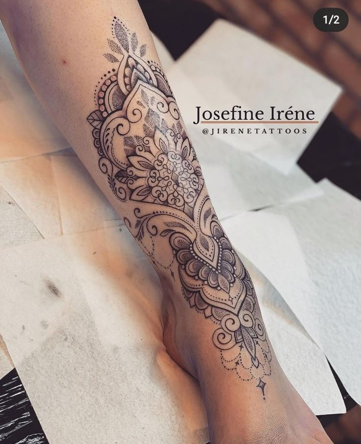 a woman's leg with a tattoo on it and the words joscfinie irne written in black ink