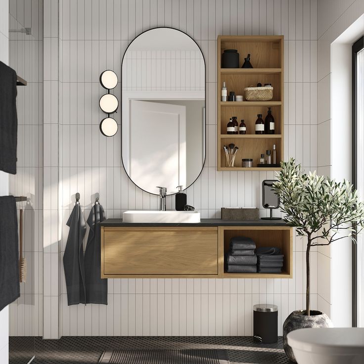 a bathroom with a sink, mirror and shelves on the wall next to a bathtub