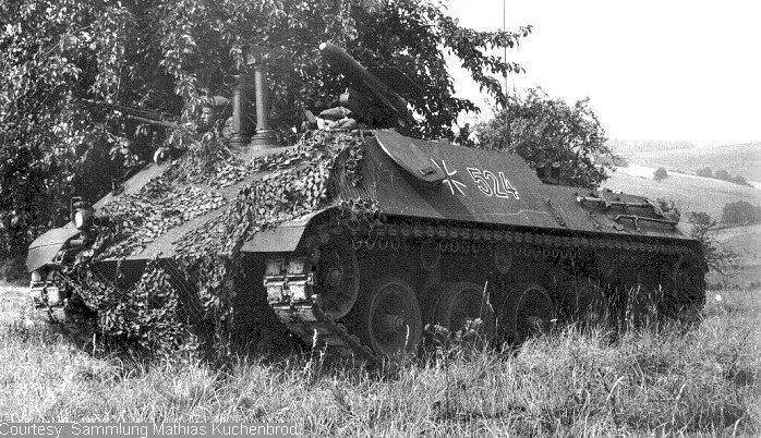 an old tank is sitting in the grass