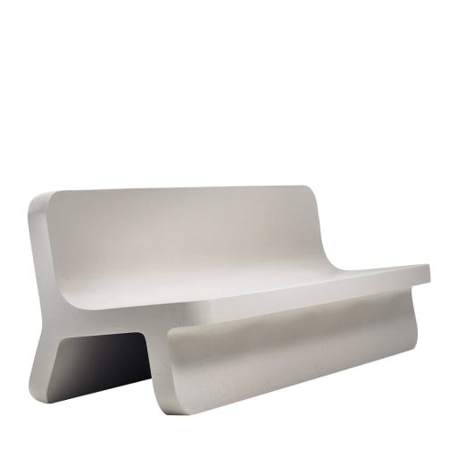 a white bench sitting on top of a white floor