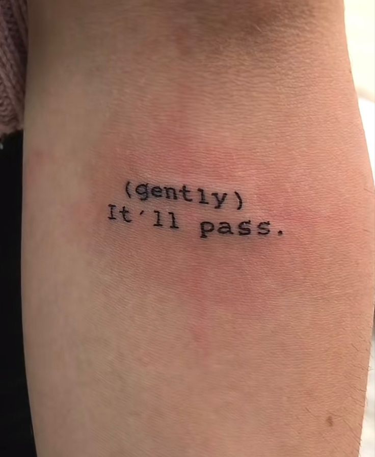 a person with a tattoo on their arm that says gently it'll pass