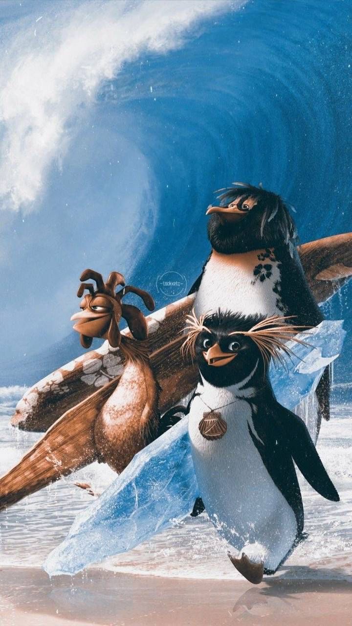 two penguins are walking on the beach with surfboards in their hands and one penguin is holding a surfboard