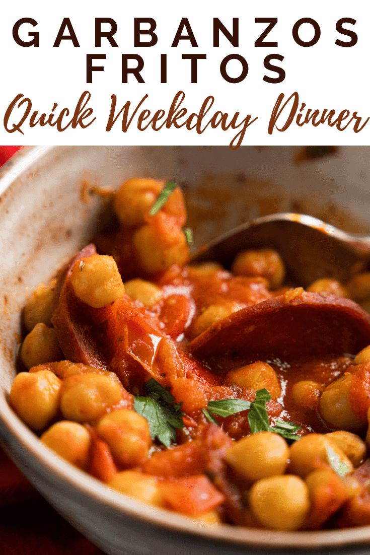 a white bowl filled with chickpeas and garbanzo's fritos