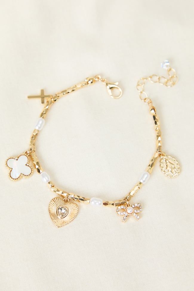 Elevate your everyday look with this versatile gold charm bracelet. Its adjustable design ensures a perfect fit, while the delicate gold chain adds uniqueness. Perfect for layering or wearing solo, this bracelet is a must-have for any jewelry collection. Gold-plated Bracelets With Dangling Charms, Adjustable Gold-plated Charm Bracelet, Adjustable Gold-plated Bracelet With Charms, Adjustable Gold Plated Bracelet With Charms, Adjustable Gold Rosary Bracelet With Charms, Gold Dainty Charm Bracelet With Extender, Dainty Metal Charm Bracelet With Extender, Adjustable Gold Charm Bracelet With Delicate Chain, Everyday Gold Bracelets With Dangling Charms