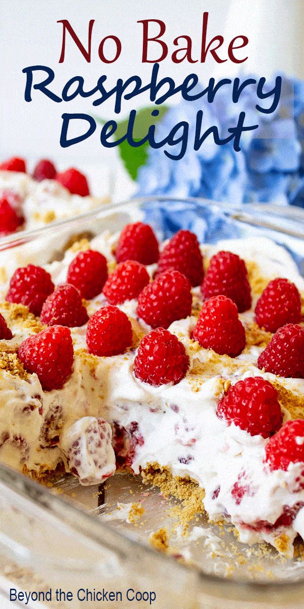 no bake raspberry delight dessert in a glass dish with the title above it