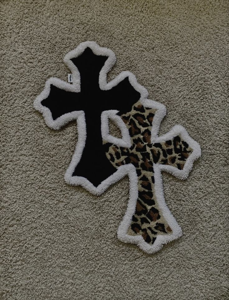 an animal print cross is on the wall