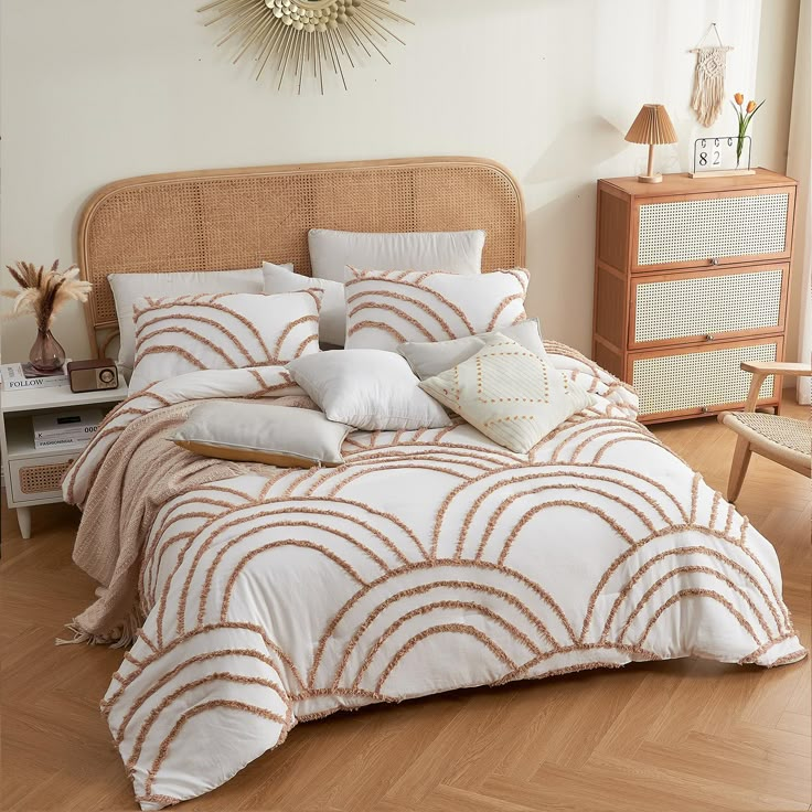 a bed with white and brown comforters in a bedroom