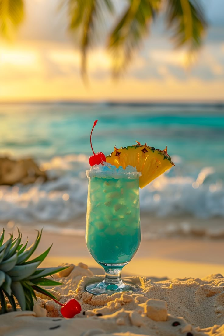 a blue drink with pineapple on the beach