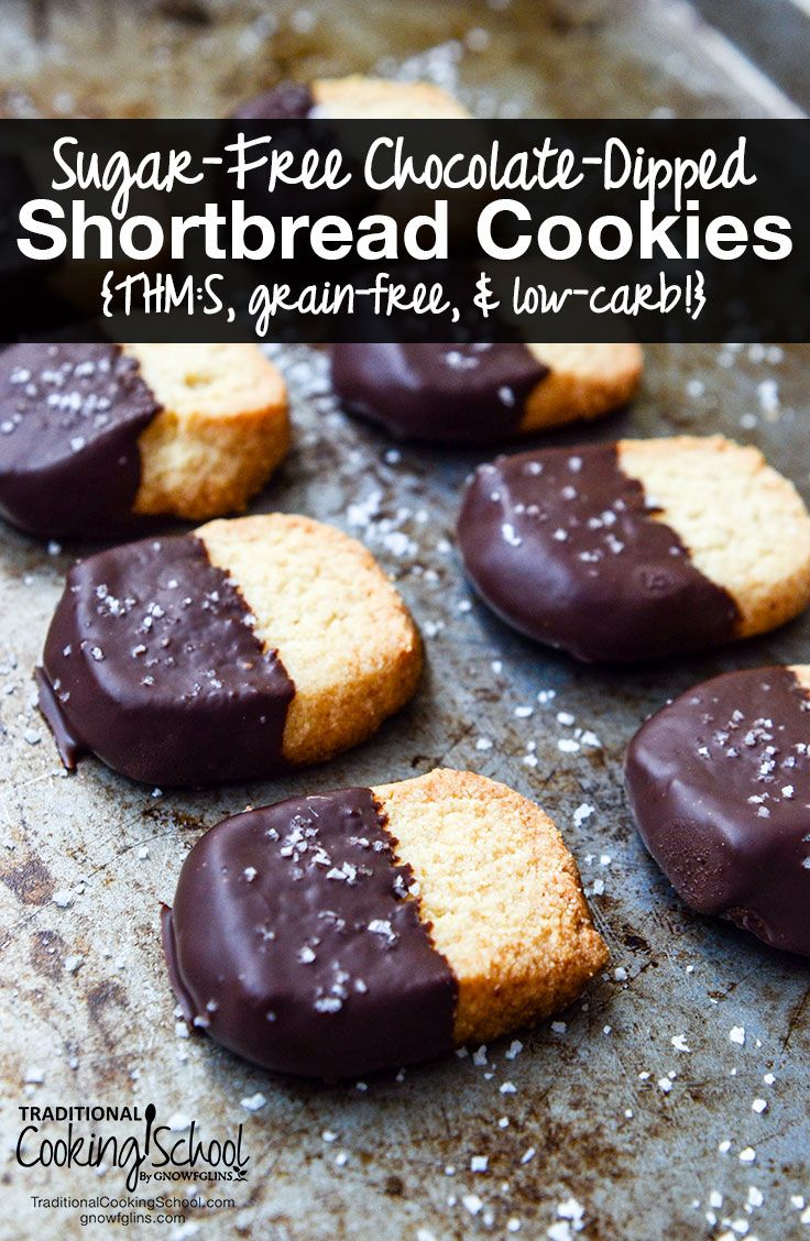 chocolate dipped shortbread cookies on a baking sheet