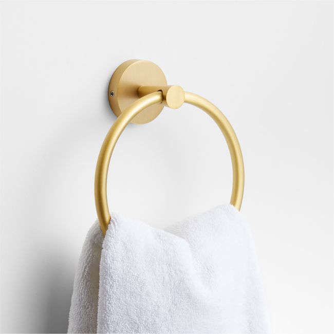 a gold towel ring hanging on the wall