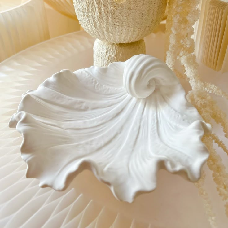 a close up of a white object on a table