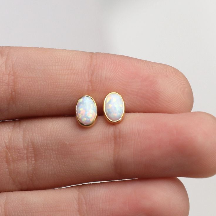 14k Gold Opal Stud Earrings,Dainty Earrings,White Opal Earrings.Minimalist Errings,Real Opal Earrings  ❤️Minimalist look and dainty design❤️ ABOUT PRODUCTS; Handmade with 14k Gold,925 Solid Sterling Silver We have color options. Silver Gold Rose gold Comes with a stylish gift-ready elegant jewelry box ** ANY PROBLEMS AND PLEASE CONTACT ME IN ORDER CONTENT, THANK YOU ** Dainty Opal Jewelry, Opal Earrings Dangle, Opal Jewelry Earrings, Opal Earring, White Opal Earrings, Gold Bead Earrings, Opal Stud Earrings, Cary Nc, Opal Earrings Stud