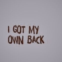 the words i got my own back written in brown ink