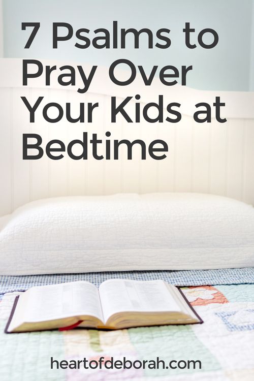 an open book sitting on top of a bed with the words 7 ways to pray over your kids at bedtime