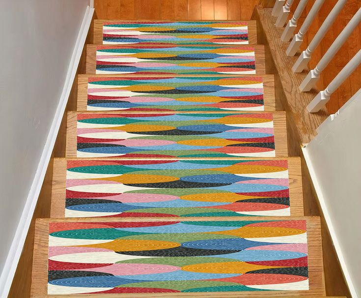 an area rug on the stairs in a house