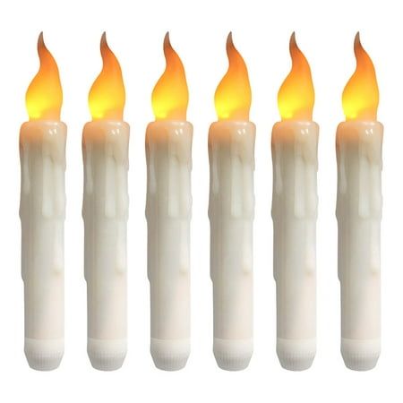 six lit candles with yellow flame on white background