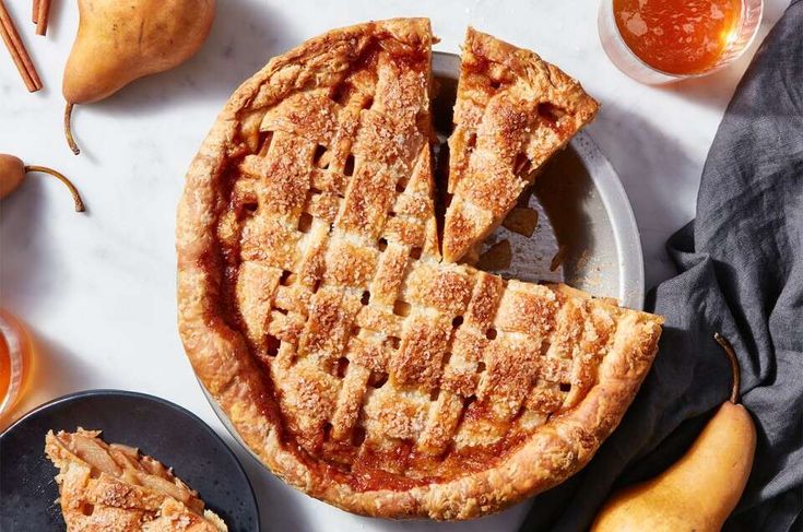 an apple pie is cut into slices and served on plates