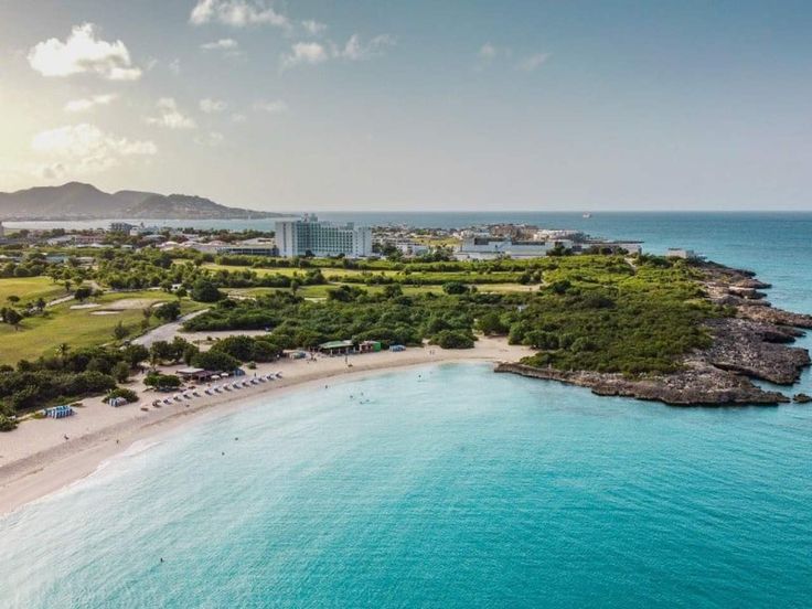 an aerial view of the resort and beach