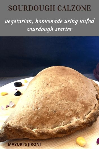 a large piece of bread sitting on top of a wooden cutting board