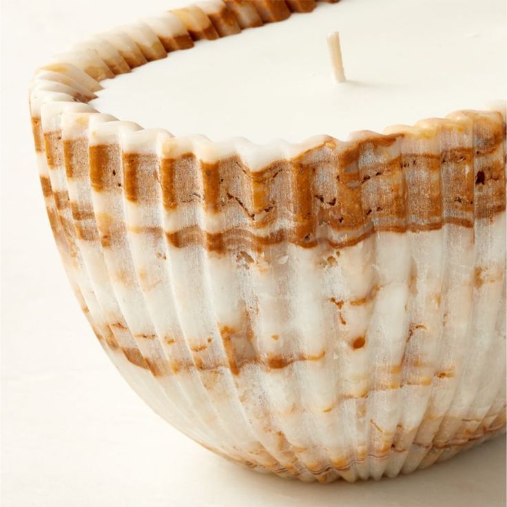 Carved from a solid piece of onyx, candle bowl is adorned with unique marbled activity and fluted detailing throughout. Inside, a hand-poured wax candle has two wicks to create twice the flickering allure. After the candle is fully burned, the vessel may be repurposed into a decorative bowl. CB2 exclusive.  -Onyx and wax -Variation in veining and activity of onyx is to be expected; each will be unique -Clean with a soft cloth -Never leave a burning candle unattended Fluted Onyx Unscented Candle Trend Candles, Candle Bowl, Natural Calm, Apartment Hacks, Clay Candle, Pottery Candle, Candle Ideas, Bowl Candle, Mexican Pottery