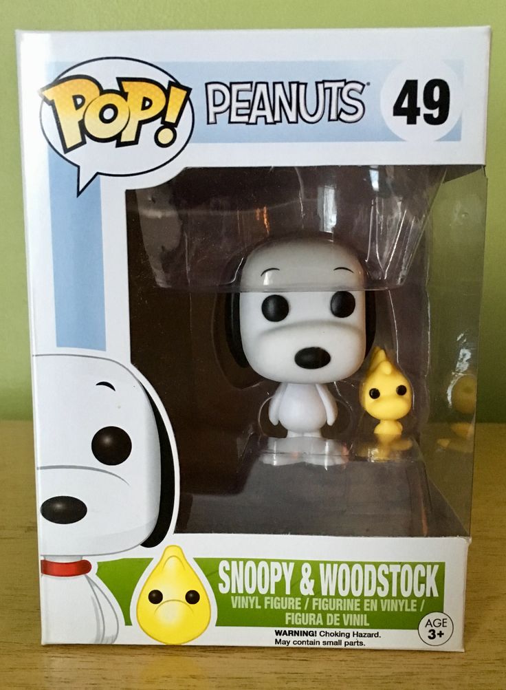 a pop - up figure in a box with snoopy and woodstock on it