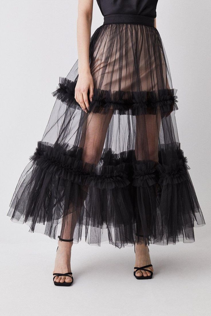 Italian Tulle Skirt/ Ruffles Skirt/ Ruffles Tulle Skirt/ Gathered Tulle Skirt/ Bridal Tulle Skirt/ Royal Skirt/ Pride Skirt/ Celeb Exude artisanal allure in this striking tulle maxi skirt. Featuring a tiered design which flares out with bountiful drama, this piece promises to make an unforgettable impression. Sheer tulle material adds a sultry element which can be emphasised when paired with a bodysuit, or juxtaposed with a tailored blazer. Sheer tulle fabric Tiered design Maxi hemline XS----BUS Sheer Tulle Skirt, Pride Skirt, Royal Skirt, Skirt Ruffles, Ruffles Skirt, Coachella Style, Tulle Material, Tulle Maxi Skirt, Sheer Skirt