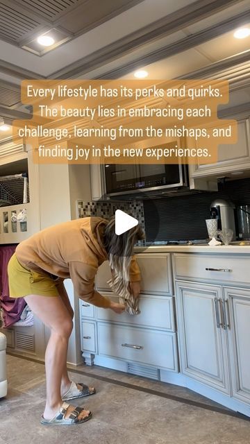 a woman leaning over a counter in a kitchen