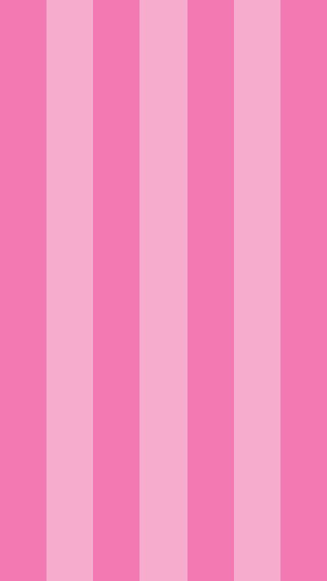 a pink striped wallpaper with vertical stripes