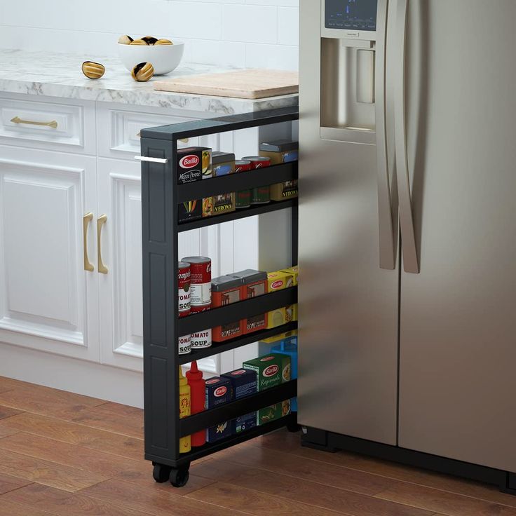 PRICES MAY VARY. Get maximum kitchen storage in a minimum amount of space with the wooden Slim Can and Spice Rack.It's on wheels, so you can use the silver pull handle on the side to access it whenever you need it.it fits in between appliances, cabinets and other narrow spaces. Rolling Pantry, Pull Out Pantry, Space Kitchen, Rev A Shelf, Hardware Resources, Home Storage Solutions, Pantry Shelf, Storage Cart, Drawer Dividers