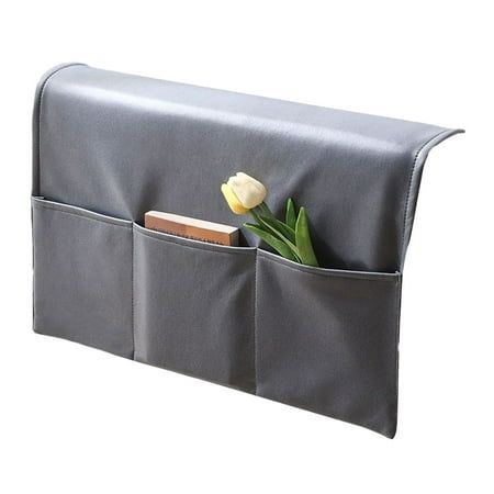 a gray purse with two pockets and a flower in it