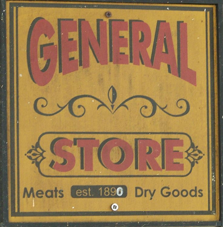 an old sign advertising general store meats and dry goods