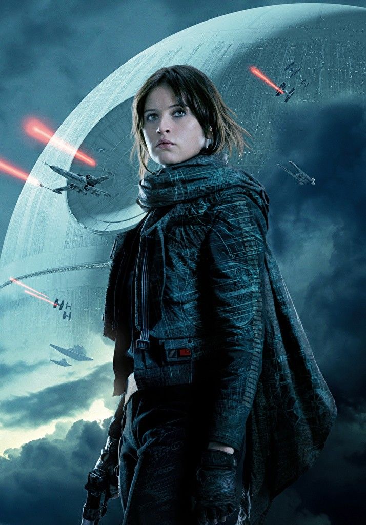 a woman standing in front of a star wars scene with lights coming from her eyes