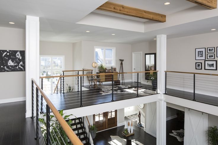 an open floor plan with stairs leading up to the second story