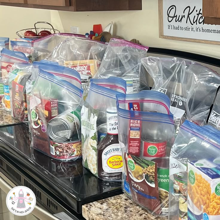 bags of food are lined up on the counter