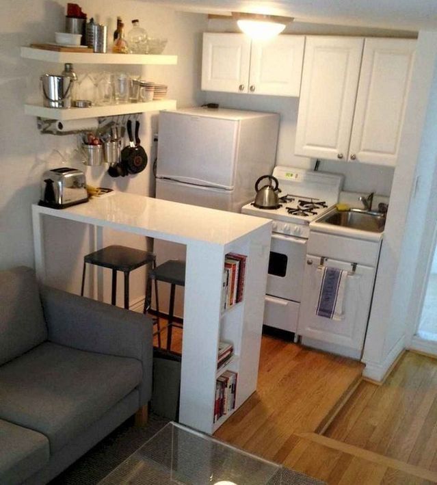 the small kitchen is clean and ready to be used as a living room or dining area