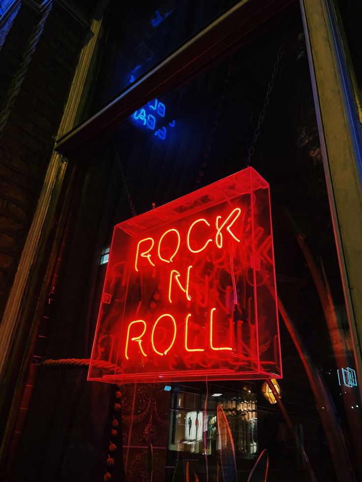 a neon sign that reads rock n roll