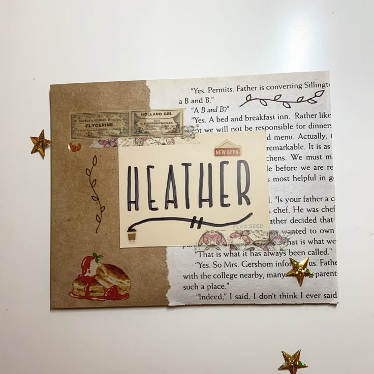 a piece of paper with the word heather written on it and some gold stars