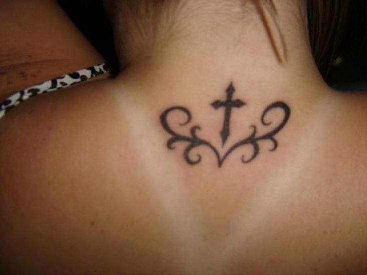 a woman with a tattoo on her back neck and cross in the middle of it