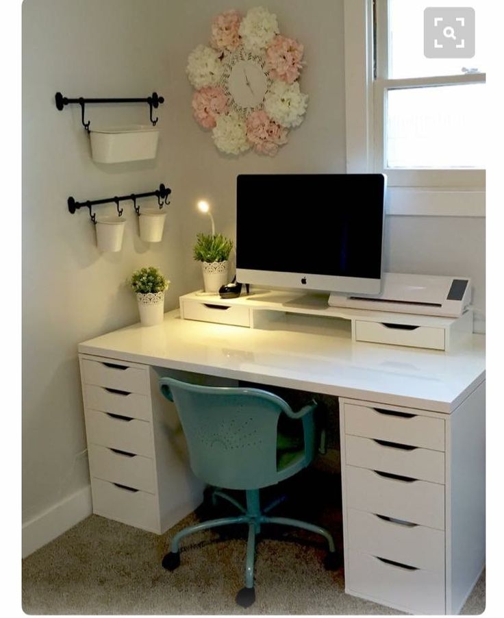 a desk with a computer on top of it