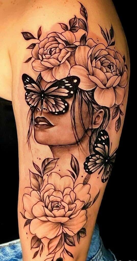 a woman with butterflies and roses on her back