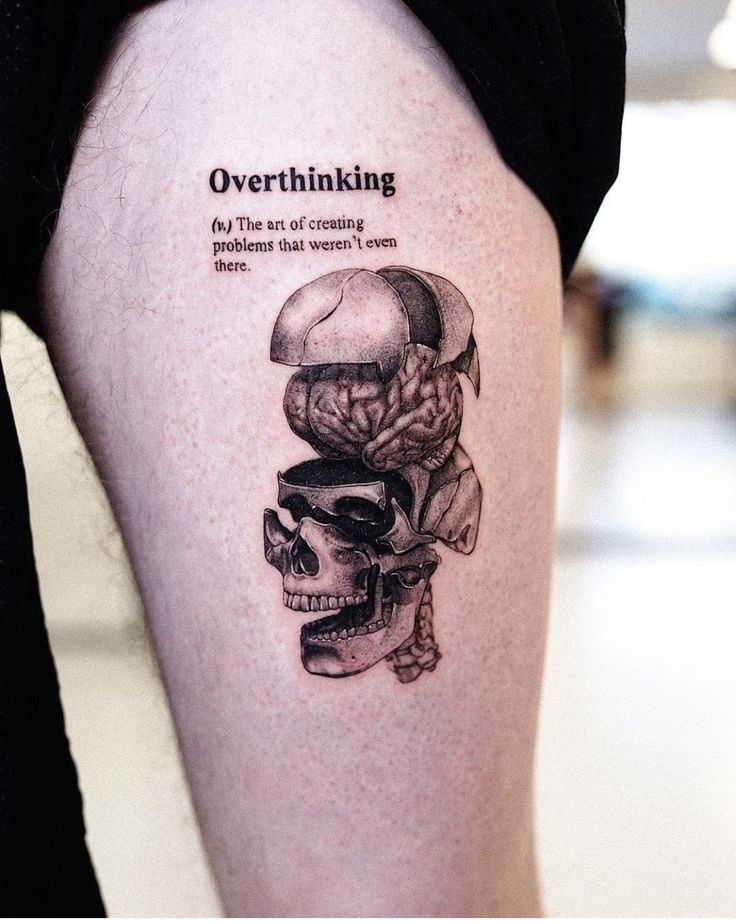 a woman's thigh with a tattoo on it that reads overthiking, do the art of crossing problems that women even have