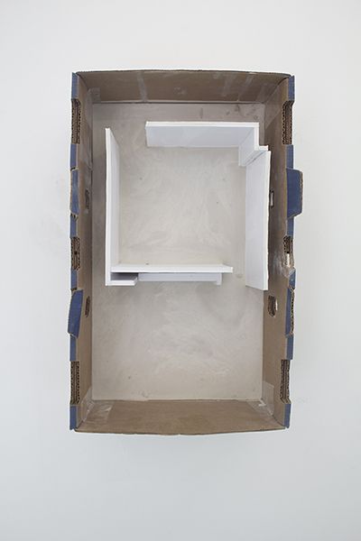 an open cardboard box with shelves in it