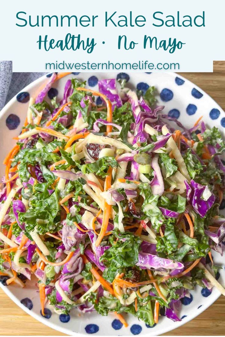 a salad with carrots, lettuce and red cabbage