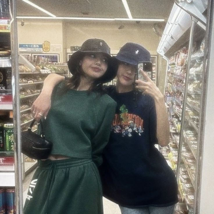 two women standing next to each other in a store