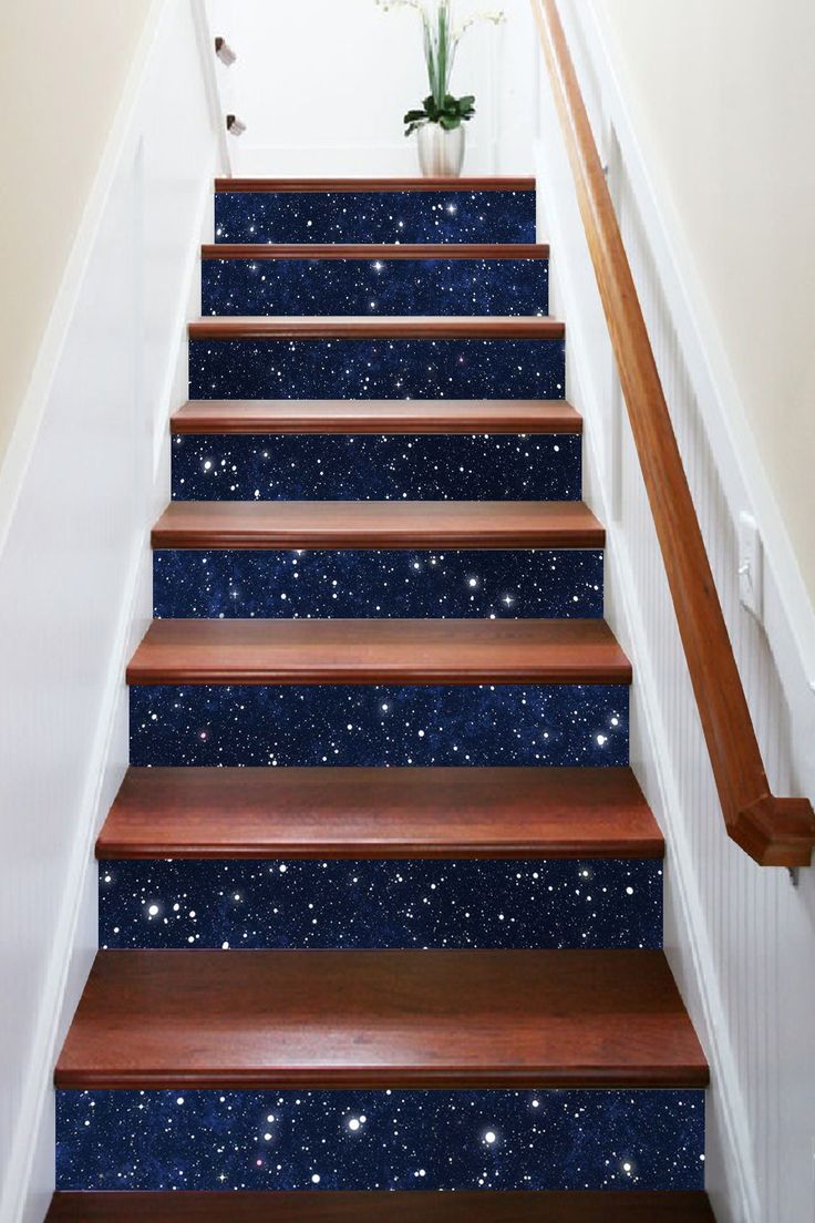 the stairs are painted with blue and white speckles, which also have stars on them